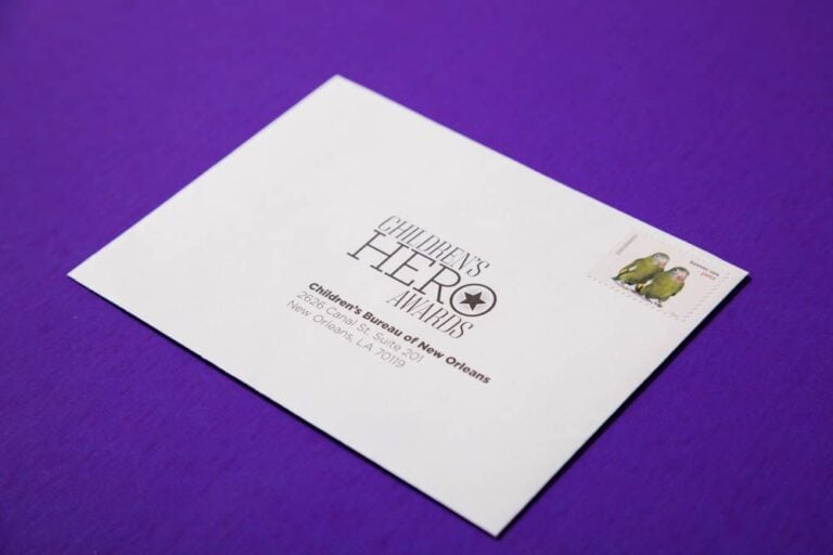 White event envelope printed and addressed, stamped ready to mail