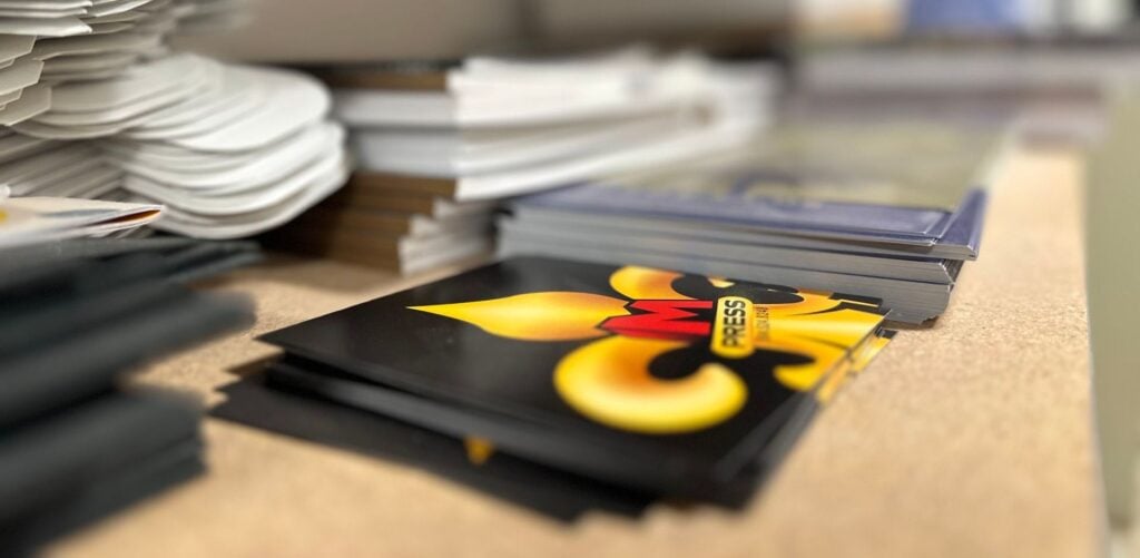 Stacks of freshly printed sheets on the floor at MPress