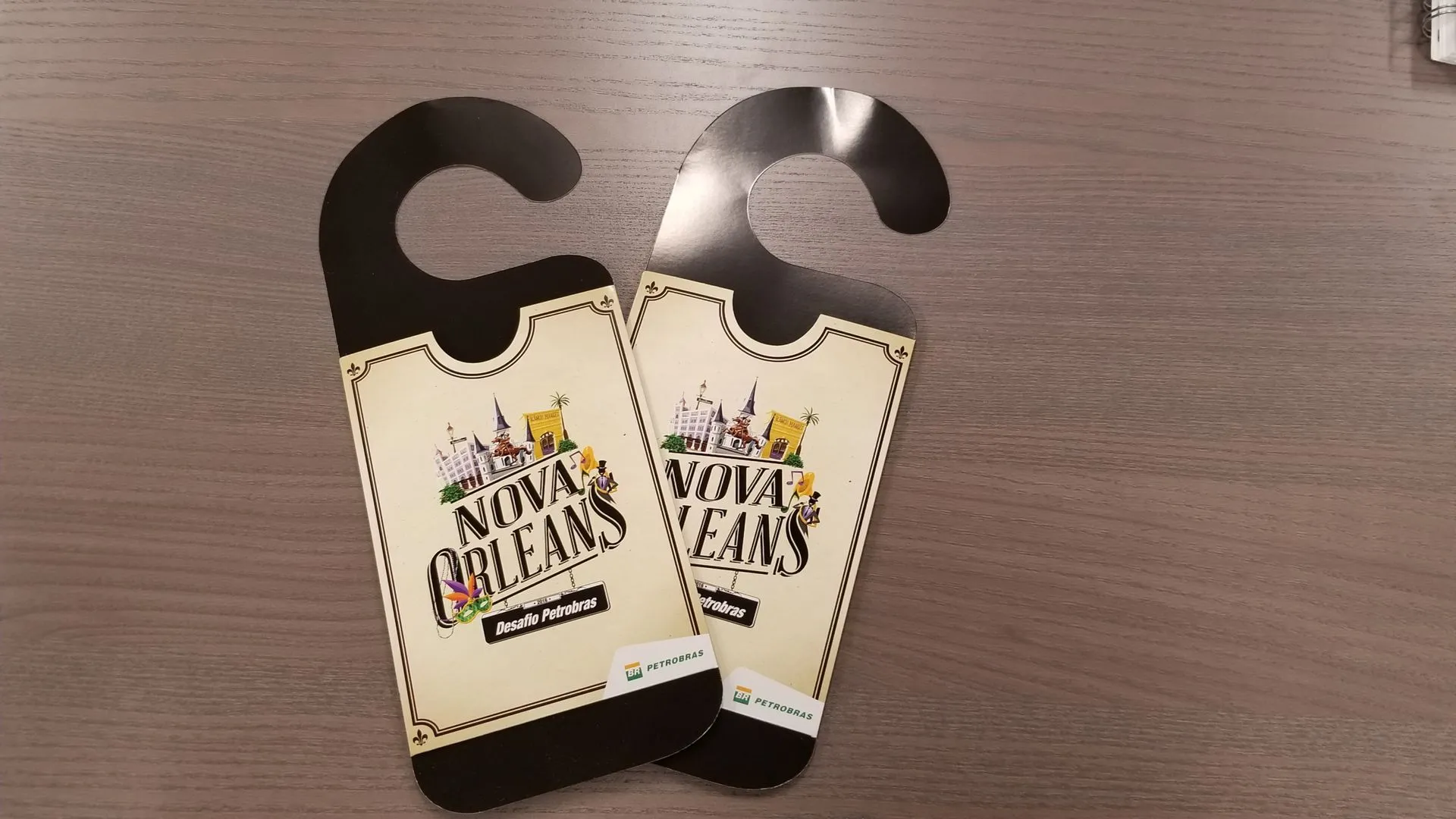 Printed hang tags in a die cut shape with punched holes